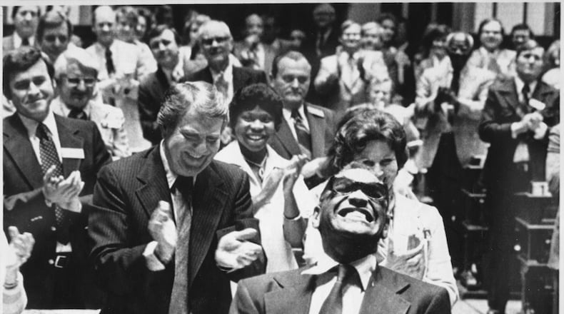 Ray Charles enjoys the ovation he received from a joint session of the Georgia Legislature. The Assembly made his version of the song 'Georgia on My Mind' the official state song after he sang it to the session in 1979.
