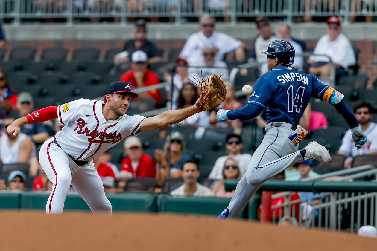 Braves first baseman Matt Olson (left) catches the throw to get the Rays' Chandler Simpson out and complete a double play during the first inning Thursday, Sept. 10, 2026, in Atlanta. The double play got Braves pitcher Martín Pérez out of a bases-loaded jam. (Erik S. Lesser/AP)