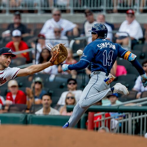 Braves first baseman Matt Olson (left) catches the throw to get the Rays' Chandler Simpson out and complete a double play during the first inning Thursday, Sept. 10, 2026, in Atlanta. The double play got Braves pitcher Martín Pérez out of a bases-loaded jam. (Erik S. Lesser/AP)