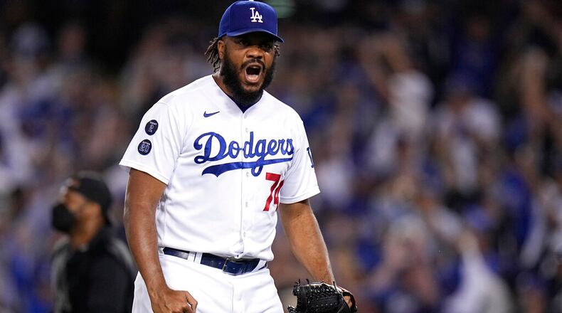 Los Angeles Dodgers pitcher Kenley Jansen reacts after getting the final out in the ninth inning against the Atlanta Braves in Game 3 of baseball's National League Championship Series Tuesday, Oct. 19, 2021, in Los Angeles. The Dodgers defeated the Braves 6-5. The Braves lead the series 2-1 games. (AP Photo/Jae Hong)