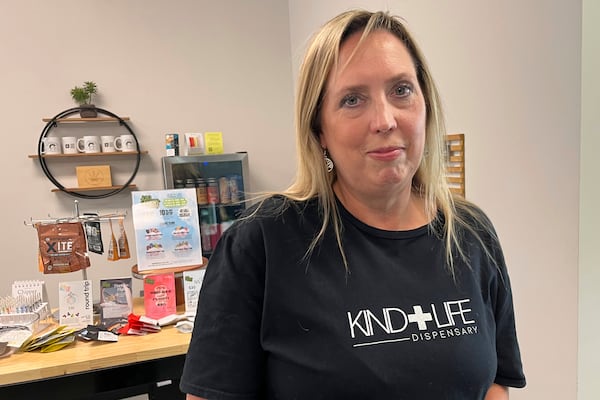 Andrea Watkins, co-owner of Kind Life Dispensary business, that sells an array of products containing hemp-based THC, poses for a photo in Lincoln, Neb., May 1, 2025. (AP Photo/Margery Beck)