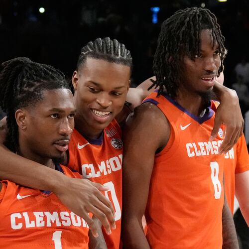 Clemson's guard Jestin Porter (1) forward RJ Godfrey (0) and forward Dallas Thomas (8) react after a win after an NCAA college basketball game against Georgia Tech, Saturday, Jan. 24, 2026, in Atlanta. (AP Photo/Brynn Anderson)