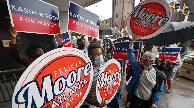 August 17, 2021 Atlanta - Supporters for Atlanta City Council President Felicia Moore and former Atlanta mayor Kasim Reed chant for their candidates outside the Atlanta City Hall on Tuesday, August 17, 2021. Atlanta City Council President Felicia Moore and former Atlanta mayor Kasim Reed filed paperwork and qualified as a candidate in the November 2nd Atlanta Mayoral Election.  (Hyosub Shin / Hyosub.Shin@ajc.com)