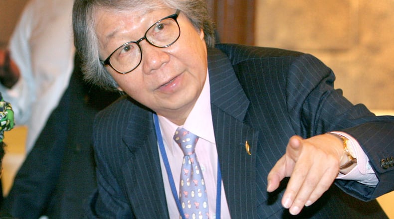 FILE - Singapore's Ambassador at Large Tommy Koh gestures during a luncheon in Singapore, Sept. 18, 2006, on the sidelines of the IMF-World Bank annual meetings. (AP Photo/Wong Maye-E, File)