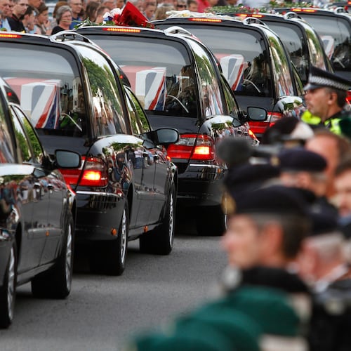 FILE - The coffins of seven British soldiers killed in Afghanistan, are driven through the town of Wootton Bassett, England, after repatriation to Britain, Tuesday, June 29, 2010. (AP Photo/Lefteris Pitarakis, file)