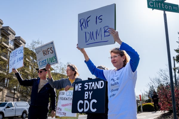 Former CDC employee Barbara Marston (right) protests the recent firings and budget cuts at the Centers for Disease Control and Prevention in Atlanta, Georgia, Tuesday, April 01, 2025. (Ben Hendren for the Atlanta Journal-Constitution)