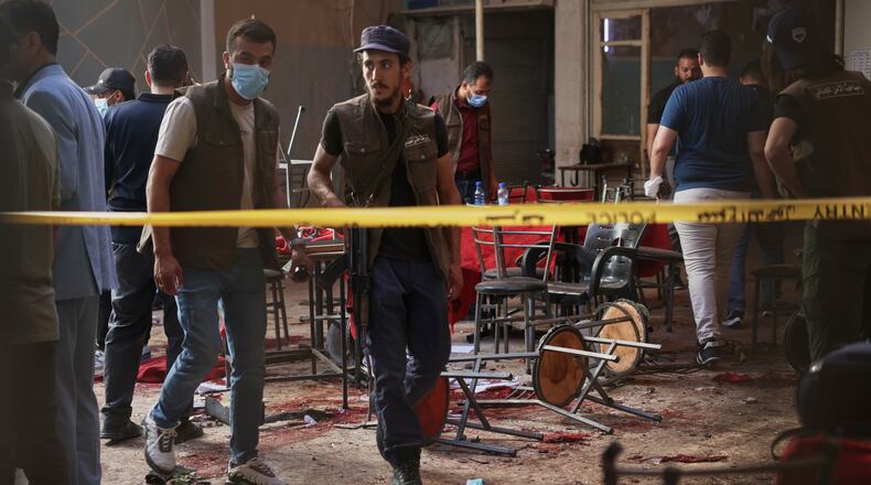 Syrian security inspects the site after an explosive device was detonated in a cafe near the main courthouse complex, in Damascus, Syria, Thursday, July 2, 2026 (AP Photo/Ghaith Alsayed)