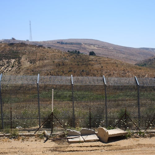 The border between Syria and the Israeli-controlled Golan Heights town of Majdal Shams is seen Tuesday, July 21, 2026. (AP Photo/Ariel Schalit)