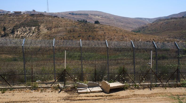 The border between Syria and the Israeli-controlled Golan Heights town of Majdal Shams is seen Tuesday, July 21, 2026. (AP Photo/Ariel Schalit)