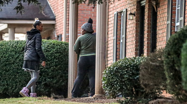 Deonna Bray, right, and Jada Miller wait on news on Bray’s missing son, 1-year old Blaise Barnett, who was taken Nov. 10 when his family's car was stolen from outside a Clarkston apartment. (JOHN SPINK / JOHN.SPINK@AJC.COM)