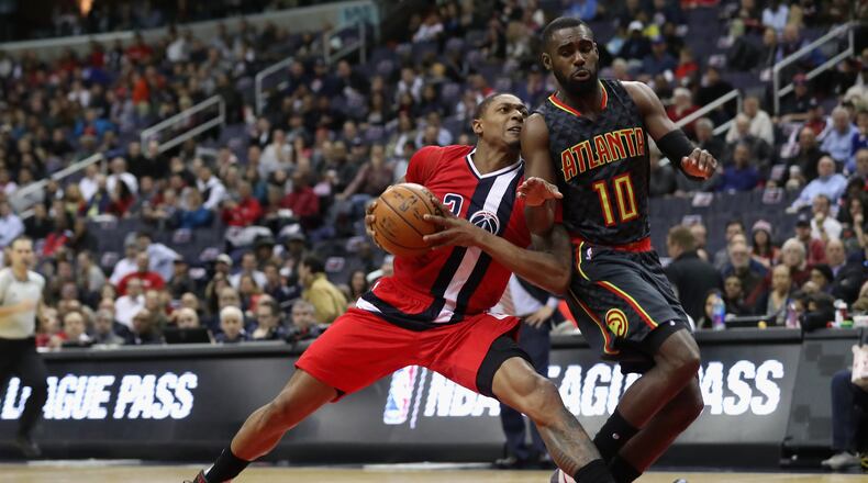 Bradley Beal of the Washington Wizards drives to the basket against Tim Hardaway Jr. of the Atlanta Hawks in the first half at Verizon Center on March 22, 2017 in Washington, DC. (Photo by Rob Carr/Getty Images)