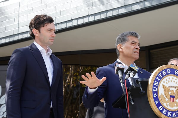 Then Health and Human Services Secretary Xavier Becerra speaks as U.S. Sen. Jon Ossoff looks on during a news conference at Ser Familia in Norcross in 2023. (Natrice Miller/AJC)