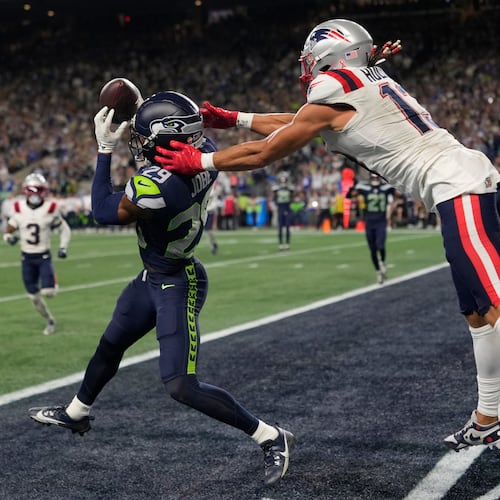 Seattle Seahawks cornerback Josh Jobe (29) intercepts a pass in the end zone intended for New England Patriots wide receiver Mack Hollins (13) during the second half of an NFL football game, Wednesday, Sept. 9, 2026, in Seattle. (AP Photo/Stephen Brashear)