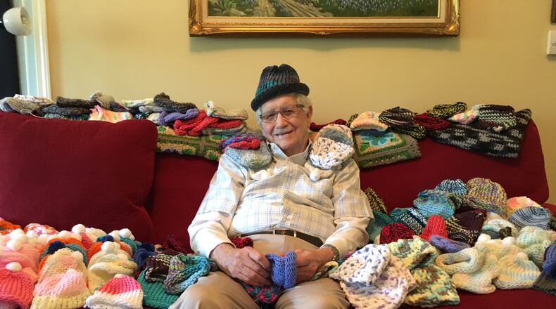 Ed Moseley, 86, recently taught himself to knit to make caps for newborns in the intensive care unit at Northside Hospital.