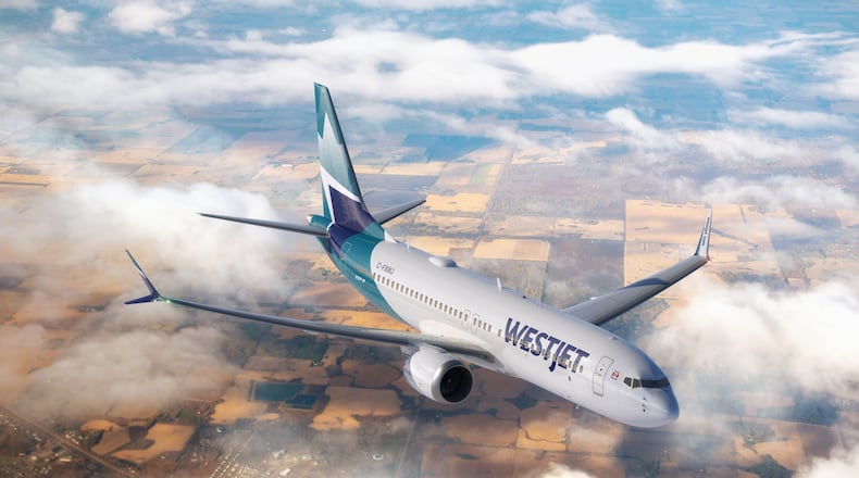 A WestJet Boeing plane flies over Edmonton in Alberta, Canada. (Courtesy of WestJet)
