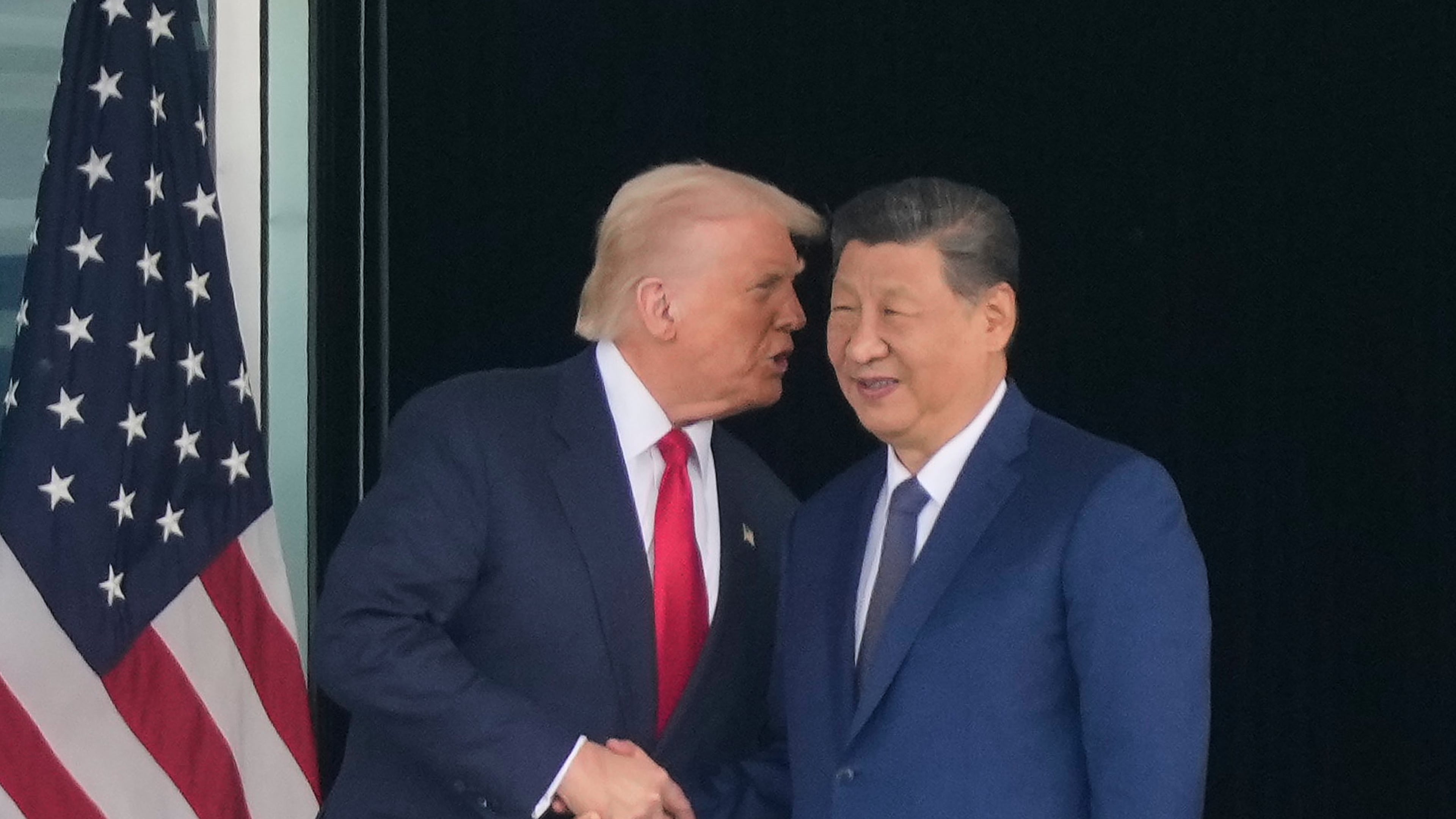 President Donald Trump, left, and Chinese President Xi Jinping, right, shake hands after their U.S.-China summit meeting at Gimhae International Airport Jinping in Busan, South Korea, Thursday, Oct. 30, 2025. (AP Photo/Mark Schiefelbein)