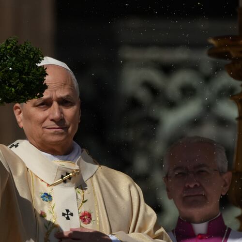 Pope Leo XIV sprinkles holy water with a bunch of hyssop sprigs as he presides over Easter Mass in St. Peter’s Square at the Vatican, Sunday, April 5, 2026. (AP Photo/Andrew Medichini)