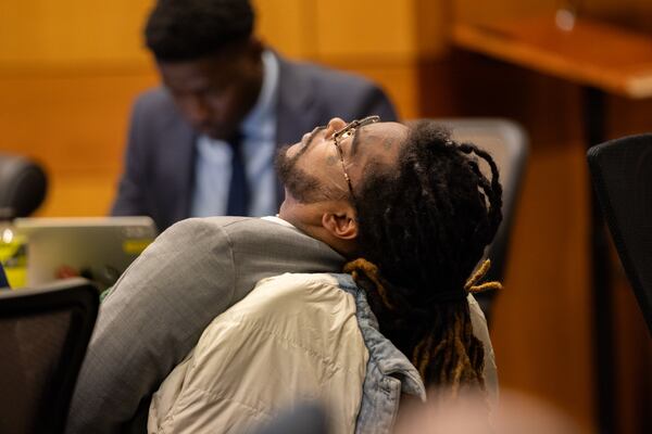 Shannon Stillwell, one of two defendants still standing trial in Fulton County's YSL case, rests before the jury arrives in court Monday.