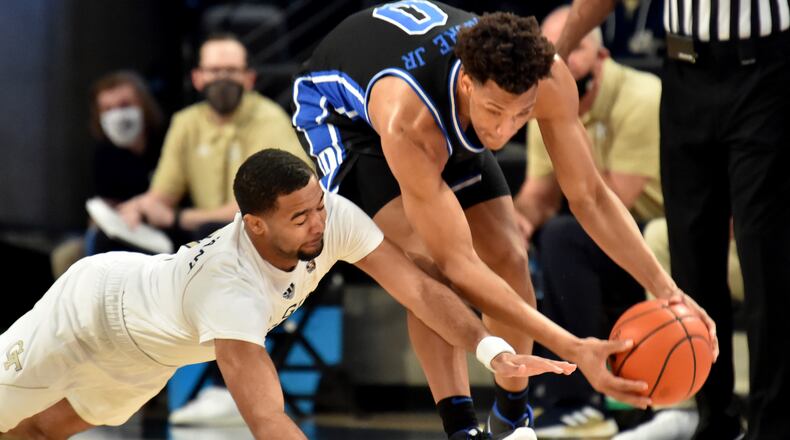March 2, 2021 Atlanta - Georgia Tech's guard Kyle Sturdivant (1) and DukeÕs forward Wendell Moore Jr. (0) fight for a loose ball in the first half of a NCAA college basketball game at Georgia Tech's McCamish Pavilion in Atlanta on Tuesday, March 2, 2021. (Hyosub Shin / Hyosub.Shin@ajc.com)