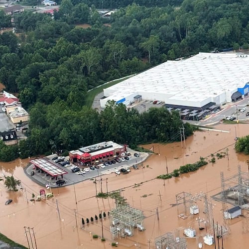 An Aerial view shows extensive flooding in Buckhannon, W.Va., Wednesday, July 22, 2026. (Office of West Virginia Gov. Patrick Morrisey via AP)