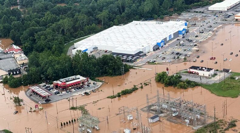 An Aerial view shows extensive flooding in Buckhannon, W.Va., Wednesday, July 22, 2026. (Office of West Virginia Gov. Patrick Morrisey via AP)