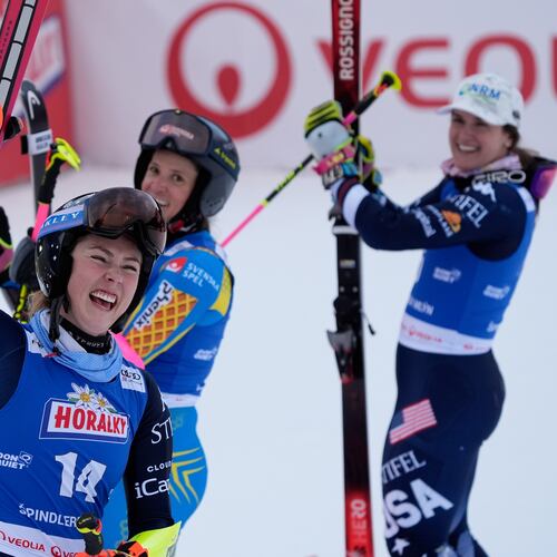 From left, United States' Mikaela Shiffrin, Sweden's Sara Hector and United States' Paula Moltzan at finish line during a women¥s alpine ski, World Cup giant slalom, in Spindleruv Mlyn, Czech Republic, Saturday, Jan. 24, 2026. (AP Photo/Giovanni Auletta)