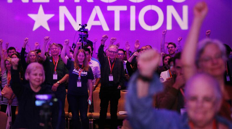 Attendees cheer speakers during an event at the Netroots Nation conference. Nearly 3,000 liberal activists from across the nation have come to Atlanta for the conference. Curtis Compton/ccompton@ajc.com