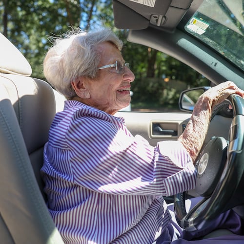 Barbara Haig, who turned 100 on Aug. 28, drives her white Ford Mustang convertible near her home in Atlanta on Wednesday, Sept. 9, 2026. (Arvin Temkar/AJC)