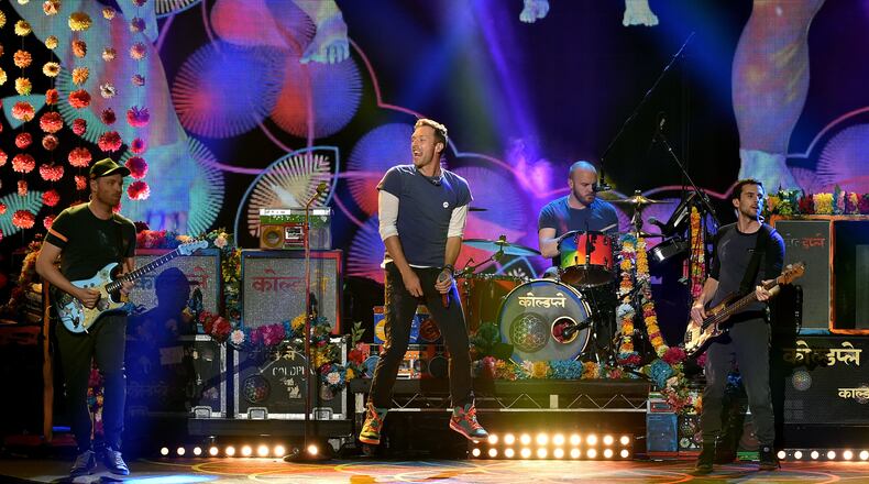 Chris Martin lifts off. (Photo by Kevin Winter/Getty Images)