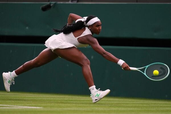 Coco Gauff of the U.S. returns the ball to Dayana Yastremska of Ukraine during their first round women's single match at the Wimbledon Tennis Championships in London, Tuesday, July 1, 2025.(AP Photo/Kirsty Wigglesworth)