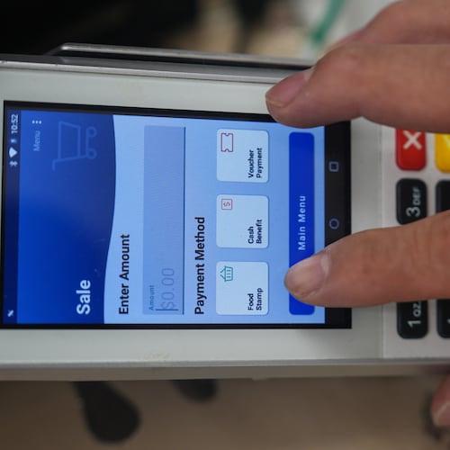 A shopper makes a purchase with food stamps on Monday, Oct. 27, 2025, in Los Angeles. (AP Photo/Damian Dovarganes)