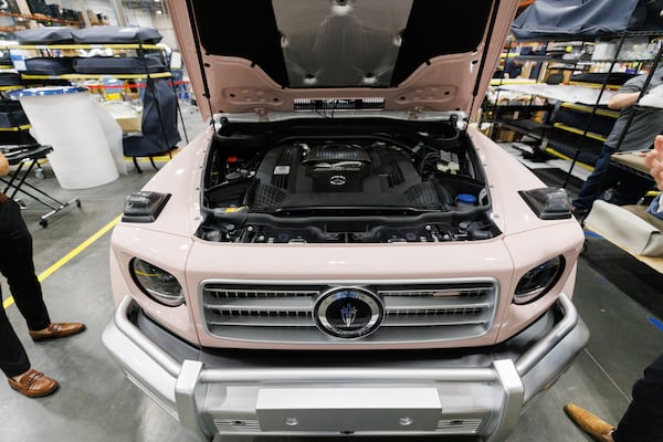 A 2026 engine is visible beneath the hood of a Vintage Modern vehicle that imitates the look of a classic Mercedes-Benz G-Wagon. It was on display in the company's Buford headquarters on June 26, 2026. (Estela Muñoz/AJC)