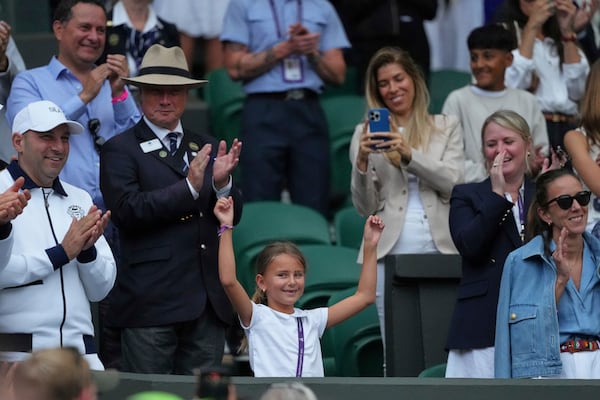 Tara, the daughter of Novak Djokovic of Serbia does a dance as she celebrates her father beating Miomir Kecmanovic of Serbia during a third round men's singles match at the Wimbledon Tennis Championships in London, Saturday, July 5, 2025. (AP Photo/Kirsty Wigglesworth)