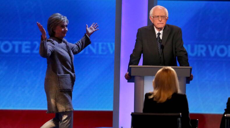 MANCHESTER, NH - DECEMBER 19: Democratic president candidate Bernie Sanders waits as Hillary Clinton walks on stage at Saint Anselm College December 19, 2015 in Manchester, New Hampshire. This is the third Democratic debate featuring Democratic candidates Hillary Clinton, Bernie Sanders and Martin O'Malley. (Photo by Andrew Burton/Getty Images)