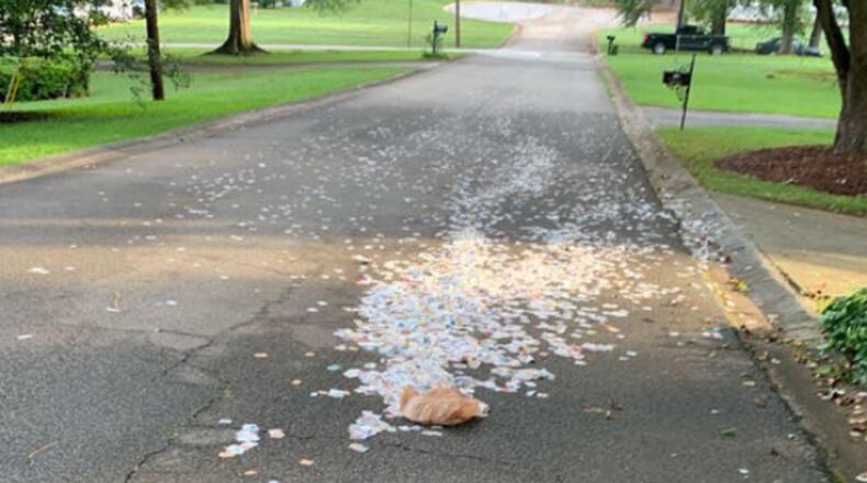 An unknown person has been chopping up inserts, stuffing them into plastic grocery bags and tossing them onto neighborhood streets and yards in the Mableton area. (Photo courtesy of Dan Colestock)