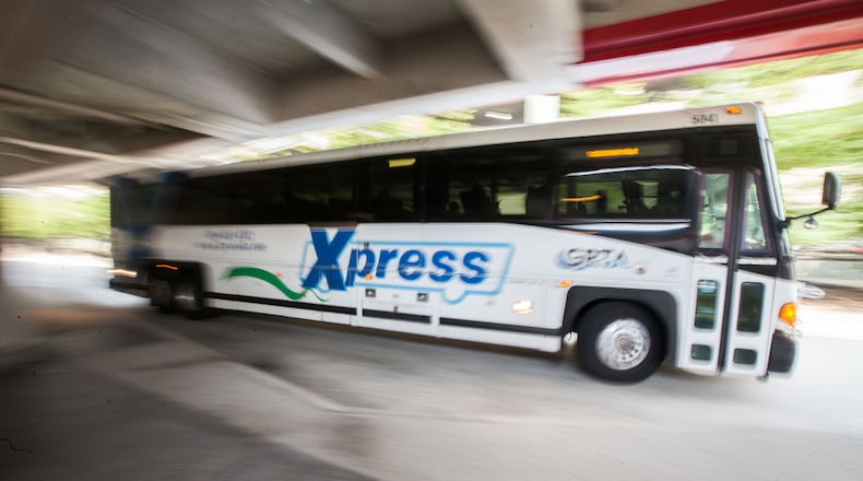 A GRTA Xpress bus leaves after picking up passengers at the Dunwoody Marta Station on Monday, Aug. 10, 2015. BRANDEN CAMP/SPECIAL