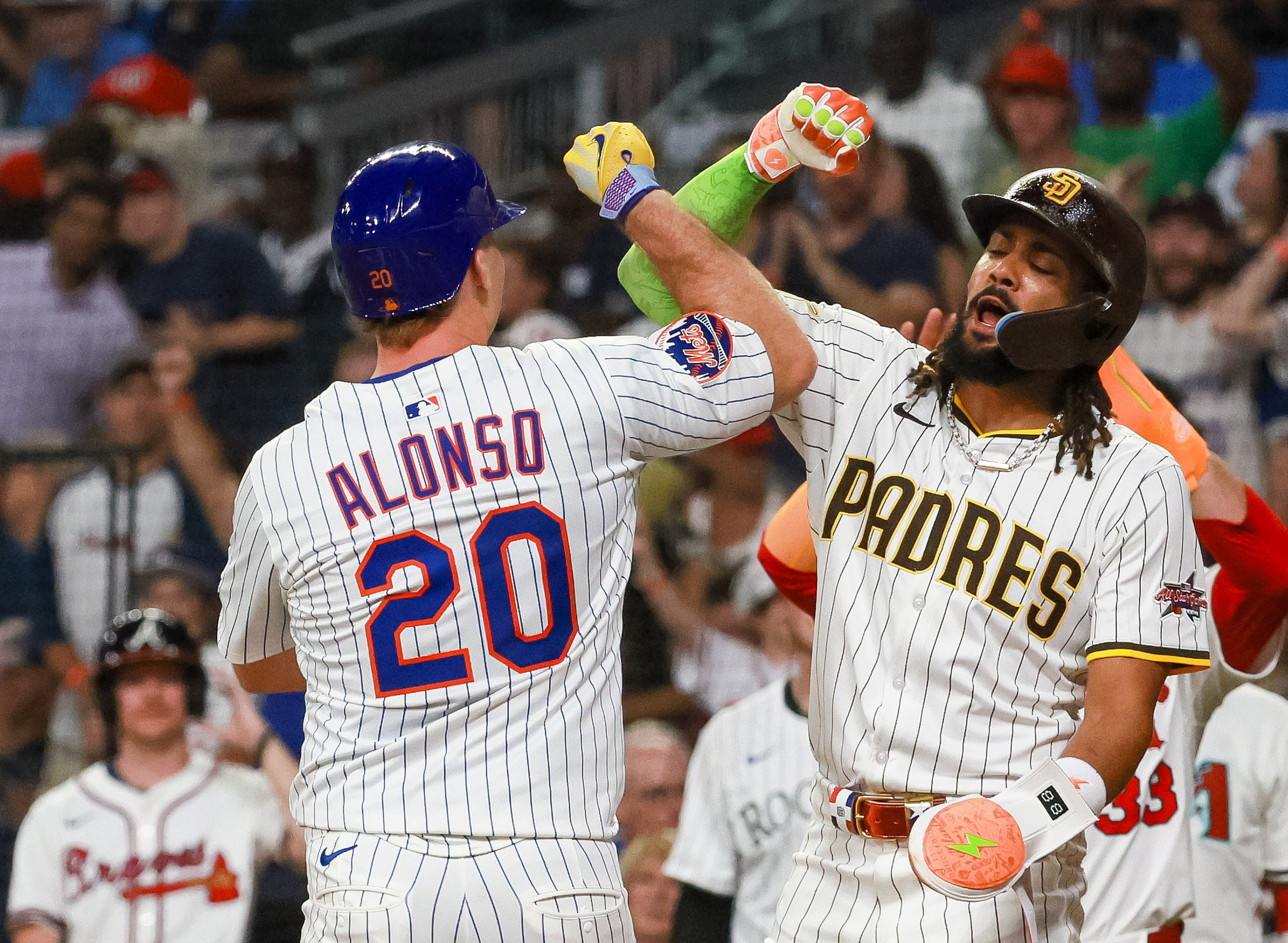 Fernando Tatís Jr. of the San Diego Padres and Pete Alonso of the New York Mets celebrate after Alonso's home run during the sixth inning of the MLB All-Star Game at Truist Park in Atlanta on Tuesday, July 15, 2025. (Jason Getz/AJC)