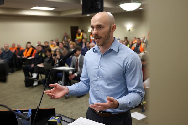 Jason Hunyar tells the Dunwoody City Council they're choosing corporations over safety. (Jason Getz/AJC)