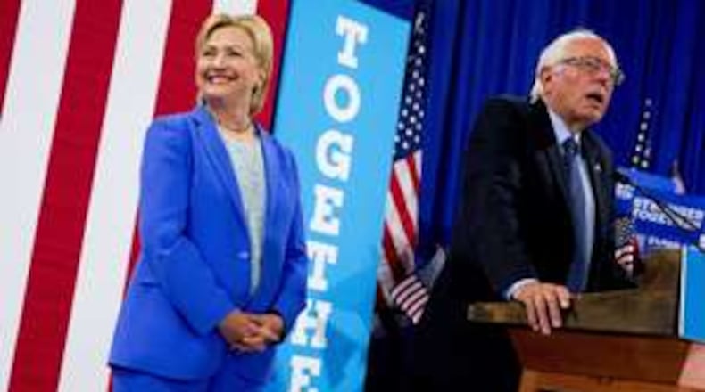 Hillary Clinton while Bernie Sanders endorses her in Portsmouth, N.H., July 12.