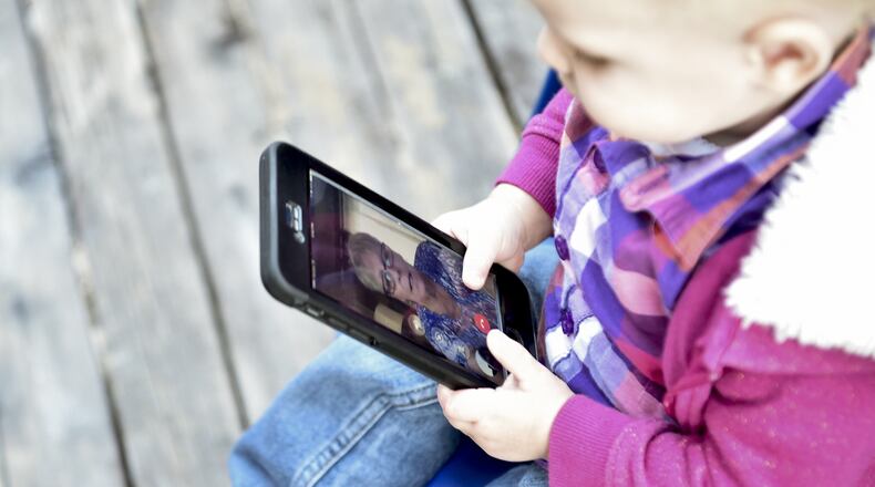 Isabelle Tolley chats with her grandmother, Wanda Tolley as her mother Katie, fixes her hair on Tuesday, Oct. 11, 2016, at their home in Spokane, Wash. (Tyler Tjomsland/The Spokesman-Review/TNS)