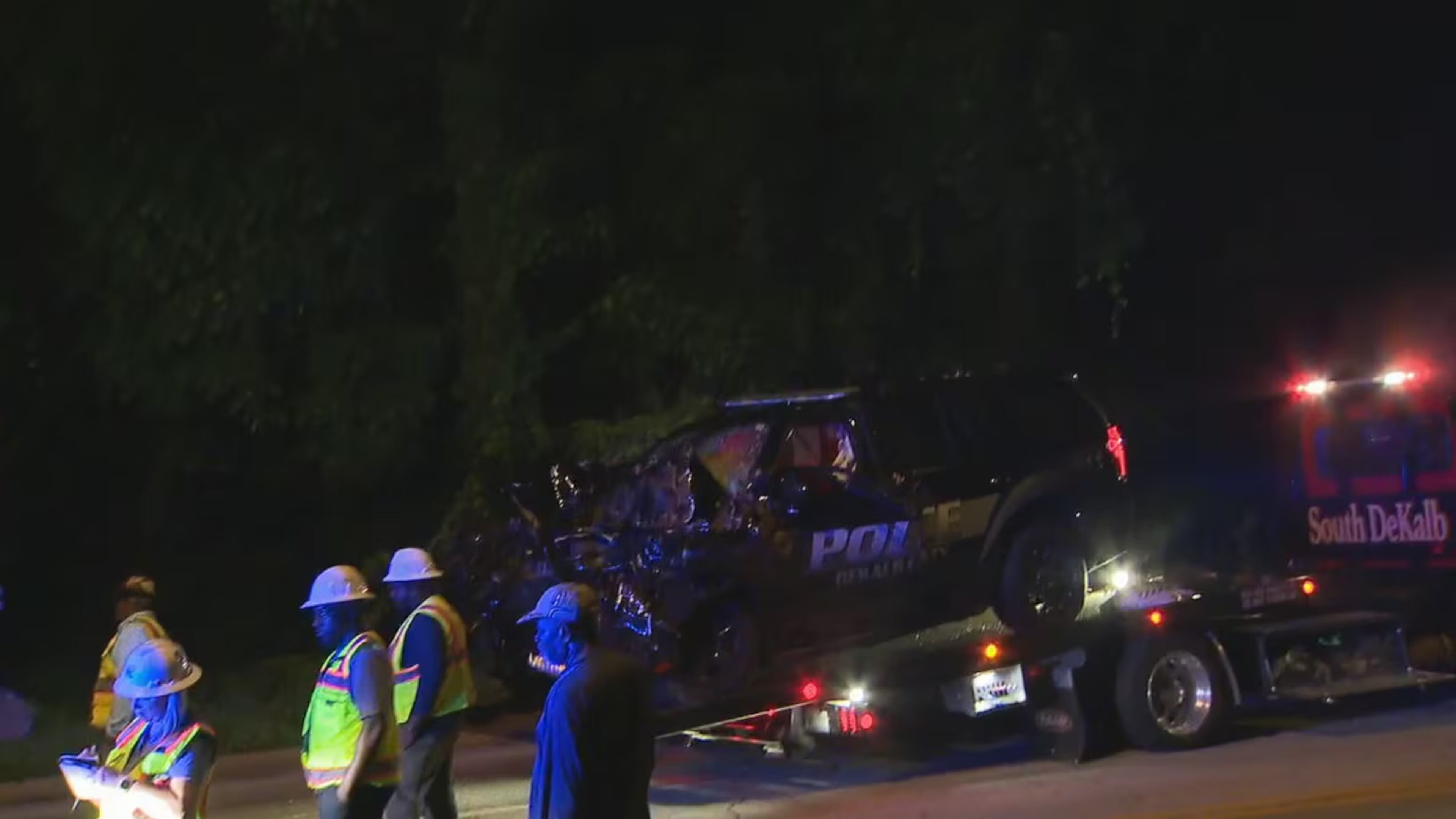 A DeKalb County police officer crashed into a dump truck during a pursuit of two people believed to be involved in armed robberies. The incident happened just after midnight Wednesday. (Courtesty of Channel 2 Action News)