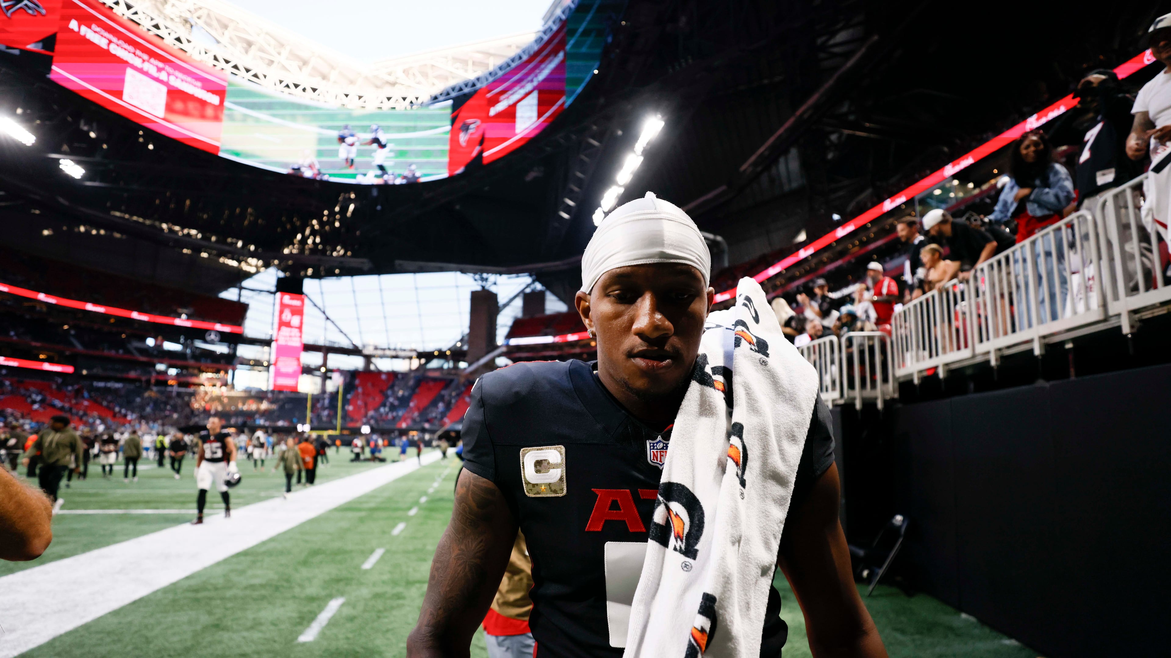 Atlanta Falcons quarterback Michael Penix Jr. (9) leaves the field after the game where the Carolina Panthers defeated the Atlanta Falcons in overtime 30-27, at Mercedes-Benz Stadium in Atlanta on Sunday, Nov. 16, 2025. (Miguel Martinez/ AJC)