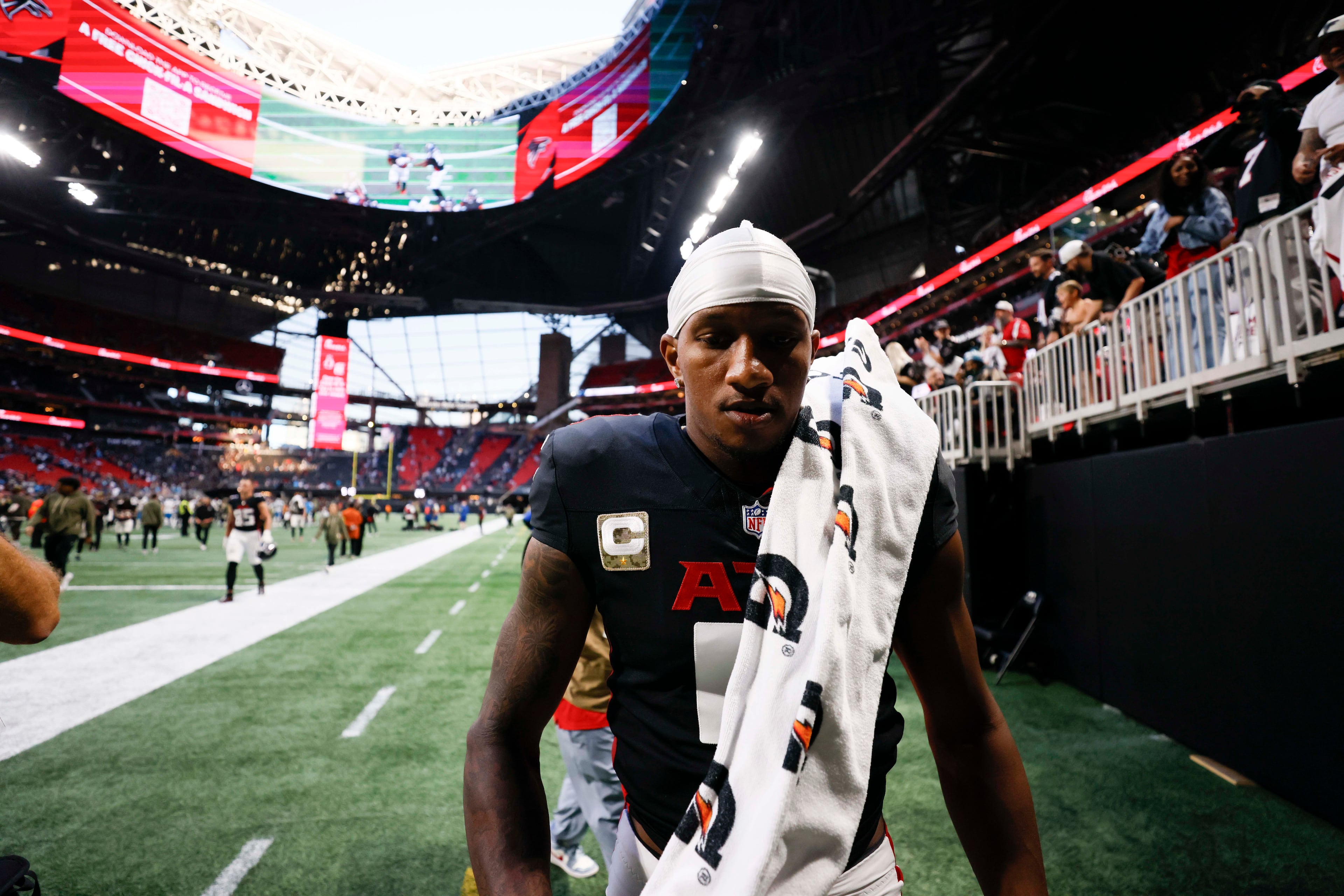 Atlanta Falcons quarterback Michael Penix Jr. (9) leaves the field after the game where the Carolina Panthers defeated the Atlanta Falcons in overtime 30-27, at Mercedes-Benz Stadium in Atlanta on Sunday, Nov. 16, 2025. (Miguel Martinez/AJC)