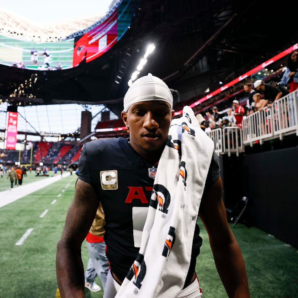 Atlanta Falcons quarterback Michael Penix Jr. (9) leaves the field after the game where the Carolina Panthers defeated the Atlanta Falcons in overtime 30-27, at Mercedes-Benz Stadium in Atlanta on Sunday, Nov. 16, 2025. (Miguel Martinez/ AJC)