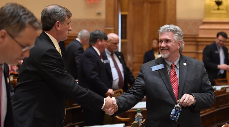 February 19, 2016 Atlanta: Sen Marty Harbin-R , left, congratulates Sen. Greg Kirk-R on the passage of HB 757 Friday February 19, 2016. The bill enables faith-based organizations and individuals to opt out of serving couples — gay, straight or unmarried — or following anti-discrimination requirements if they cite a sincerely held religious belief or moral conviction regarding marriage. BRANT SANDERLIN/BSANDERLIN@AJC.COM