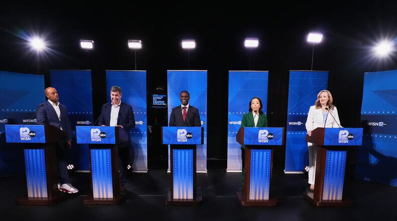 From left, Democratic gubernatorial candidates Mandela Barnes, Joel Brennan, David Crowley, Francesca Hong and Kelda Roys attend a primary debate in Milwaukee, Tuesday, July 28, 2026. (AP Photo/Nam Y. Huh)