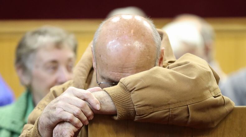 November 21, 2016, Clayton: Albert Neimann, of Rabun Gap, reacts as he finds out the Rock Mountain Fire is approaching Betty’s Creek Road. He attended a public briefing with federal fire officials at the Rabun County Courthouse on Monday in Clayton. Neimann is worried about an elderly friend who lives on the road closer to the fire. Curtis Compton/ccompton@ajc.com