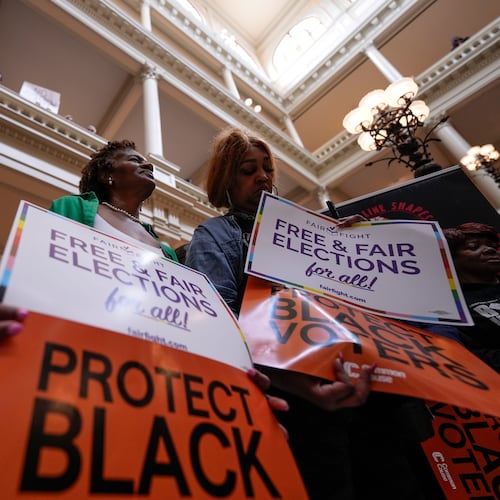 People demonstrate during a special legislative session at the state capitol, Wednesday, June 17, 2026, in Atlanta. (AP Photo/Mike Stewart)