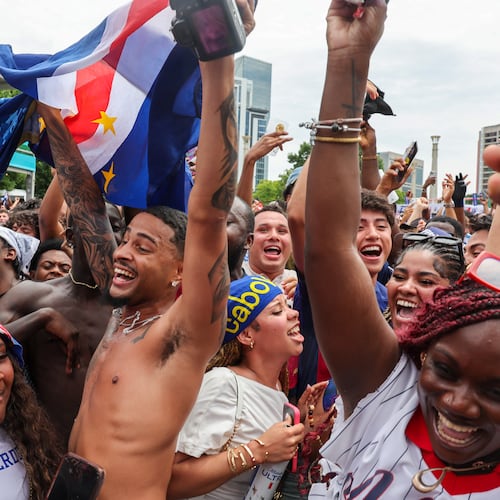 Cape Verde fans celebrate at FIFA Fan Festival in Centennial Olympic Park on Monday, June 15, 2026, following a 0-0 draw between Cape Verde and Spain at the FIFA World Cup in Atlanta. It was the first of eight World Cup matches to take place in Atlanta, and the match was Cape Verde’s first World Cup appearance. (Arvin Temkar/AJC)