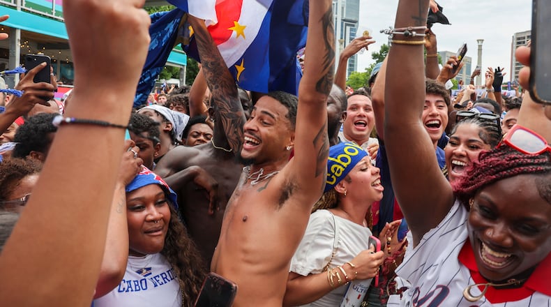 Cape Verde fans celebrate at FIFA Fan Festival in Centennial Olympic Park on Monday, June 15, 2026, following a 0-0 draw between Cape Verde and Spain at the FIFA World Cup in Atlanta. It was the first of eight World Cup matches to take place in Atlanta, and the match was Cape Verde’s first World Cup appearance. (Arvin Temkar/AJC)